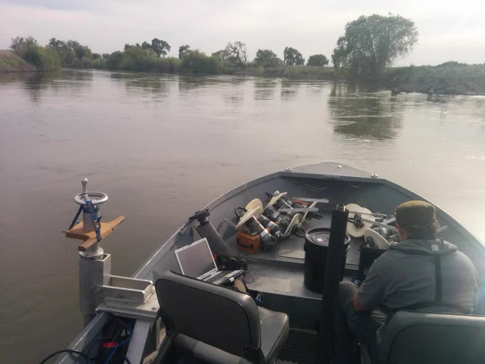 graduate student conducting research on a boat in washington.