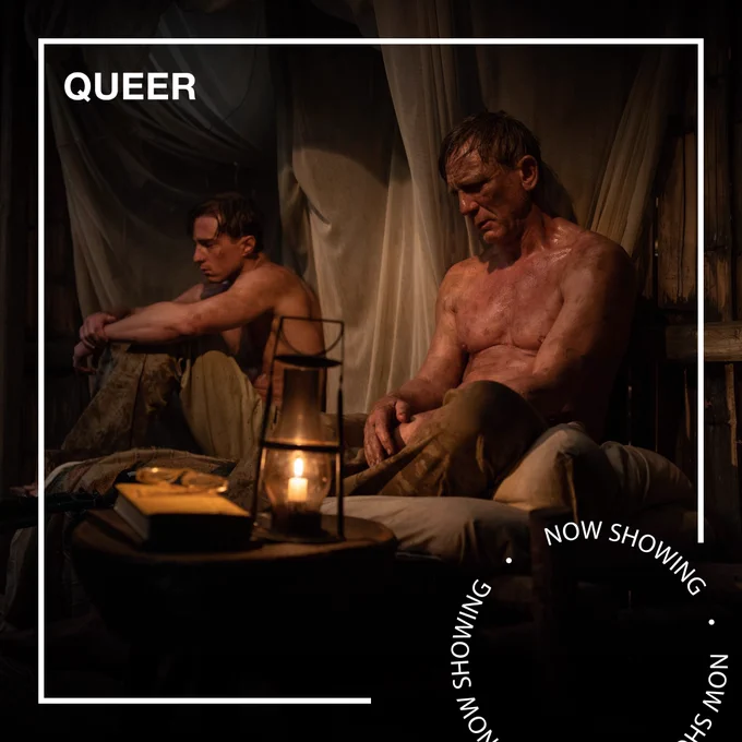 Two shirtless men who are covered in dirt sit in a tent looking solemn. Text - Queer, Now Showing