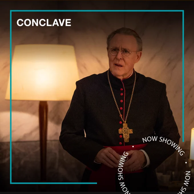 A man dressed as a member of the Catholic clergy. Text - Conclave, Now Showing