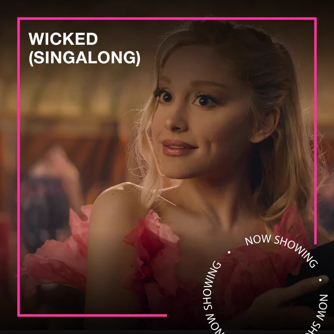 A woman with blonde hair and a pink dress smiles. Text - Wicked (Singalong), Now Showing.
