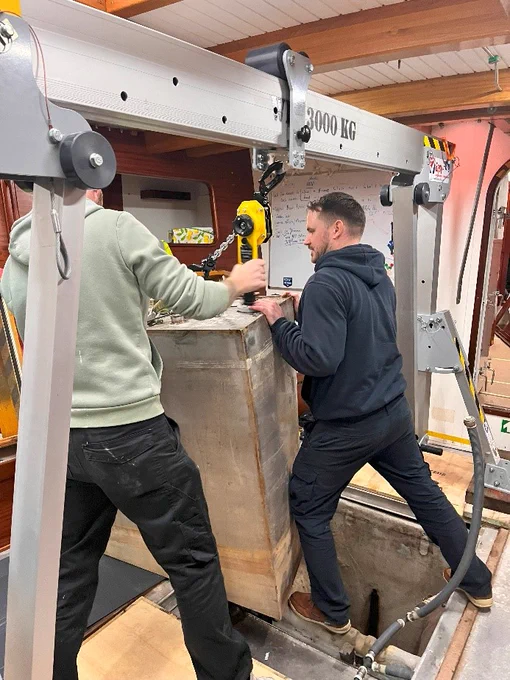 Osmotech team lifting one of the tanks