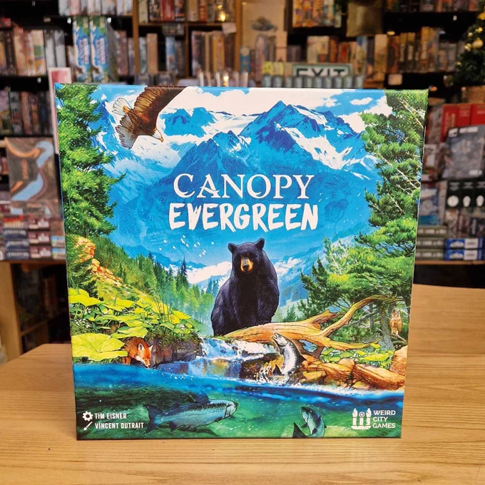 The board game Canopy Evergreen with an illustration of a bear by a river.