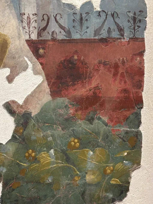 Detail of the garland with stylised dolphin and foliage designs