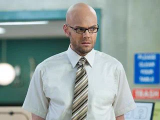 A screenshot of Jeff Winger in a bald cap from the Community episode Documentary Filmmaking Redux