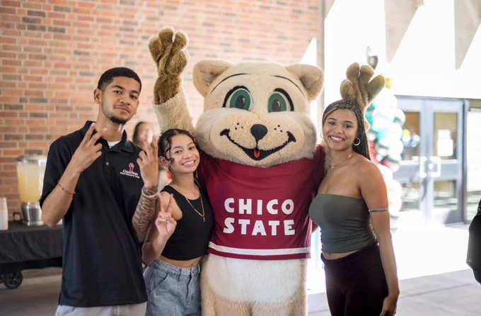 
Willie the Wildcat poses with students during the Black Resource Center grand opening at Chico State