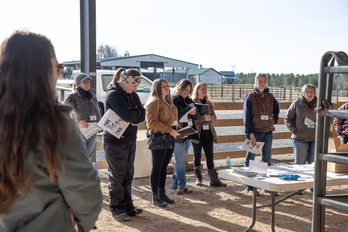 Participants listen to an instructor