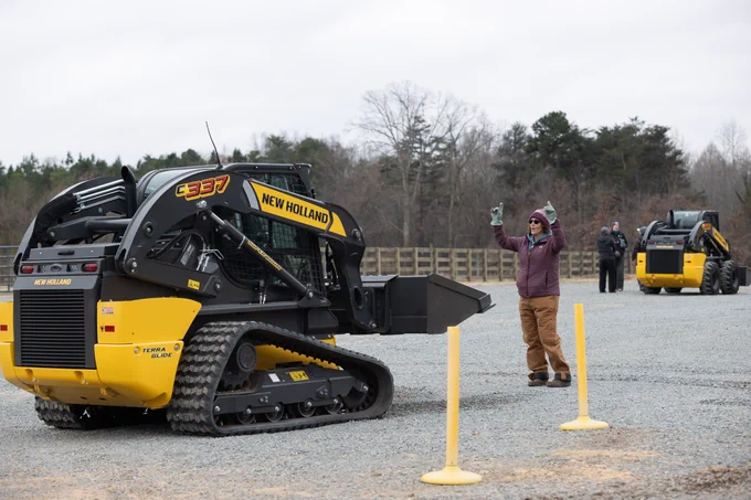 Participants work with large machinery