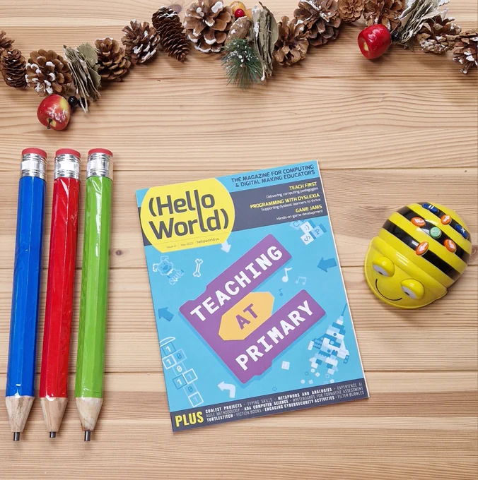 Photo of a physical copy of Hello World, Issue 21, 'Teaching At Primary'. The magazine is displayed in the centre of the picture.