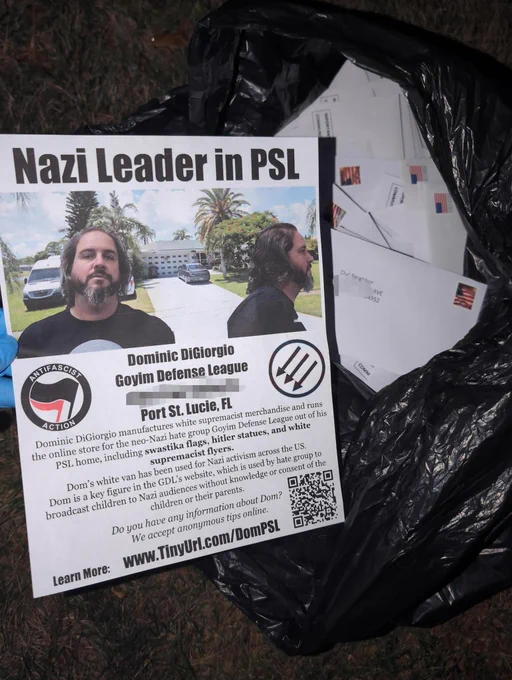 A flyer that says 

"Nazi Leader in PSL

Dominic DiGiorgio
Goyim Defense League
Port St. Lucie, FL"

The flyer has a photo of dominic digiorgio in front of a picture of his home. The flyer is on top of a garbage bag of envelopes.