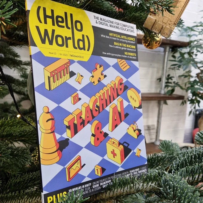 A photo of a physical copy of Hello World, Issue 22 displayed in a Christmas tree. 