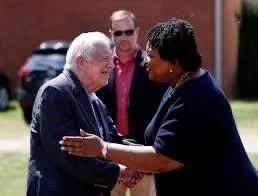 President Carter greeting Stacey Abrams.