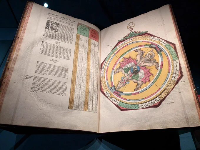 A photograph of a dragon volvelle, used to calculate eclipses, in the manuscript Arch. B b.7. Peter Apian, Astronomicum Caesareum, 1540. From the 'Oracles, Omens and Answers' exhibition.