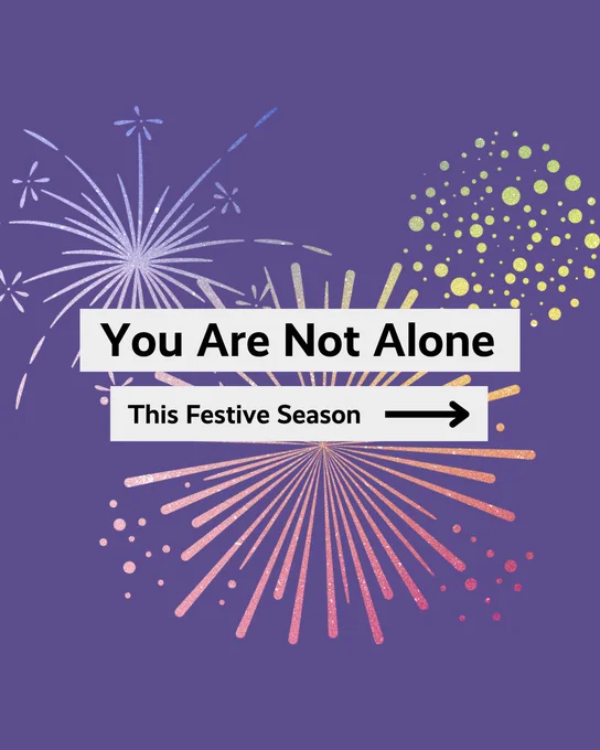An illustration featuring a message "You Are Not Alone This Festive Season" surrounded by colorful fireworks on a purple background.