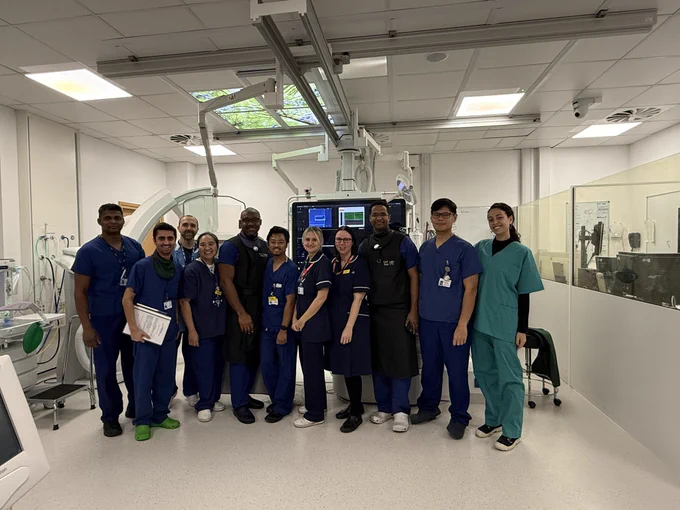 A photo of the research team and cath lab team in the lab