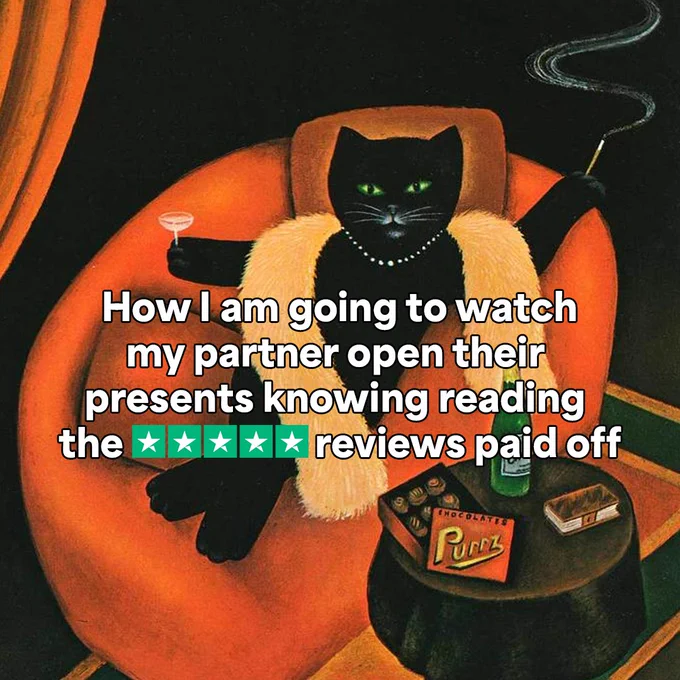 Painting of a cat sitting on an orange chair, holding a martini glass and wearing a pearl necklace. A chocolate box titled "Purr" are visible beside the chair. Text overlay reads: "How I am going to watch my partner open their presents knowing reading the 5-star reviews paid off.