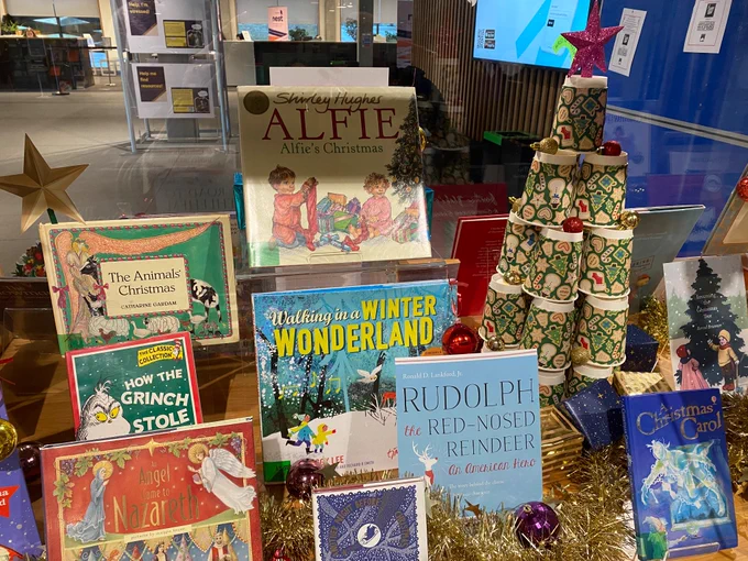 Image shows a collection of festive reads in the library book display