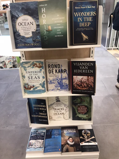 Picture of a bunch of Dutch books in a bookshop. On the right is enemies of all by Richard Blakemore!