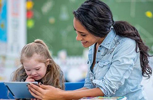 Teacher helping a student