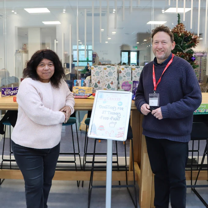 Staff members with the table of donations