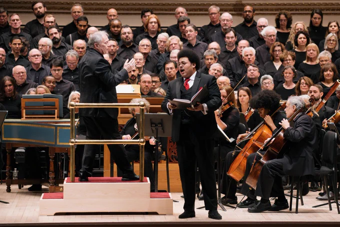 Singing a solo in front of the chorus and orchestra of Oratorio Society of New York on the stage of Carnegie Hall.

📸: Brian Hatton