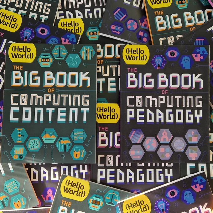 A photo depicting multiple copies of Hello World's Big Books. 

In the middle of the image a copy of the Big Book of Computing Content is featured in the centre slightly to the left. Whilst a copy of The Big Book of Computing Pedagogy is featured slightly to the right.