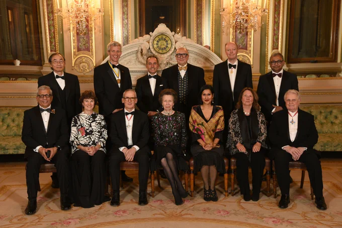 HRH The Princess Royal, sat at the centre of a group photo, surrounded by Academy Fellows who are either seated or stood in rows. HRH is immediately flanked by the Academy President to her right and CEO to her left.