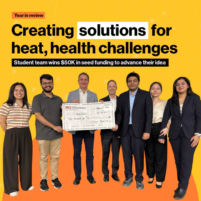A group of seven people holding a large check with a yellow-orange geometric background. Text reads "Creating solutions for heat, health challenges."