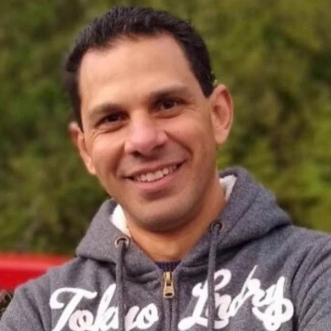 Ehab stood outside and smiling at the camera.