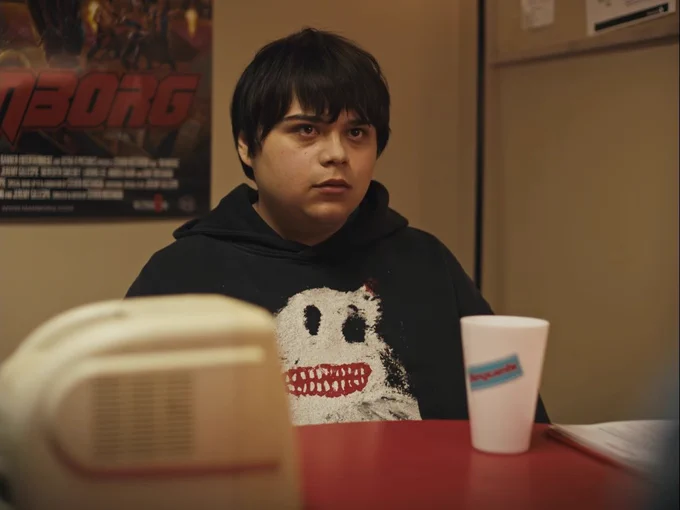 Isaiah Lehtinen in I Like Movies wearing the HOT GARMUT hoody