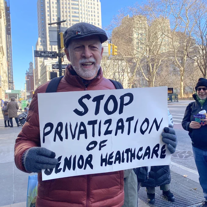 Retiree holding a sign saying stop privatization of senior care