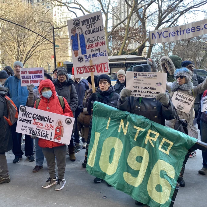 Retirees holding signs & banners