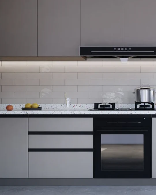 Backsplash of a kitchen, white beige tiles laid in a 50/50 offset. Countertop, cabinet. Shiny