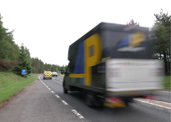 A goods vehicle travelling along the A9 in Scotland