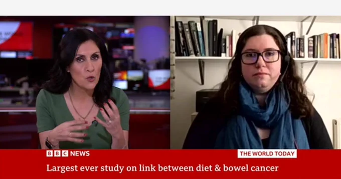 Newsreader, Maryam Moshiri and Ruby Osborn from the Bowel Cancer UK research team participating in a split-screen interview on BBC News about a study on diet and bowel cancer.