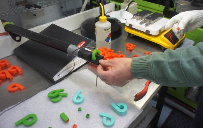 Running sample parts at an injection molder in Maine to get the right color and translucency.