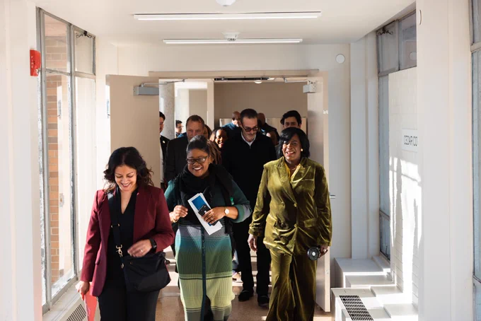 Mayor Cherelle L. Parker and a group walking down a hallway