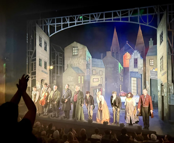 Photos of the cast on stage