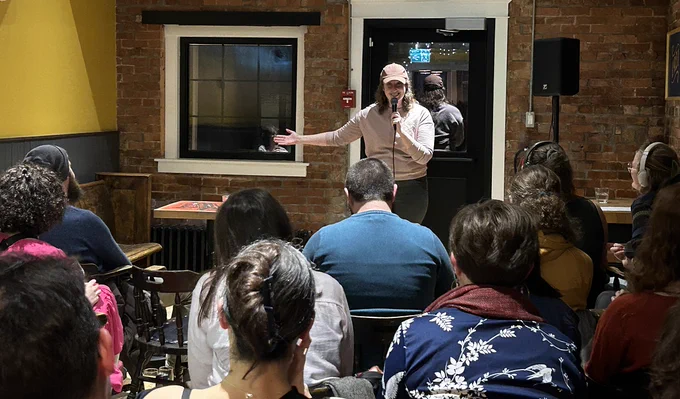 Dr. Emma McClure of the SMU Philosophy department, doing standup comedy at the Oxford Taproom in December.  