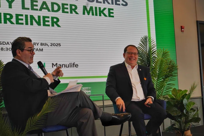 Mike speaking on stage at the Kitchener Chamber of Commerce.