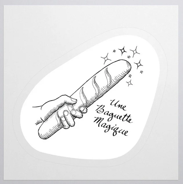 A product image of a black and white hand-drawn, cross-hatched sticker in which a hand is wielding a baguette which is emitting sparkles from the end. The text next to the drawing (part of the sticker) reads "Une Baguette Magique" (baguette can mean both wand and bread in French). The sticker has a white background and is the shape of a very rounded triangle.