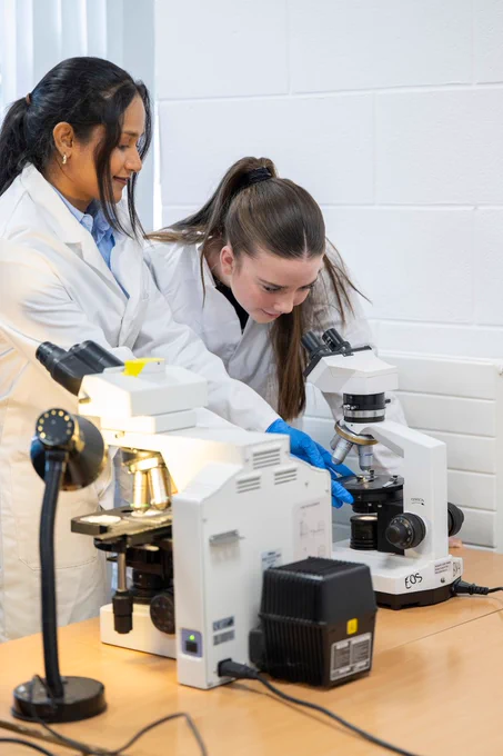 Using microscopes to see microplastics is Róisín Greaney, Ballinrobe Community School, Co Mayo, with help from course instructor Isuri Weerasinghe.  Photos – Credit Andrew Downes, XPOSURE