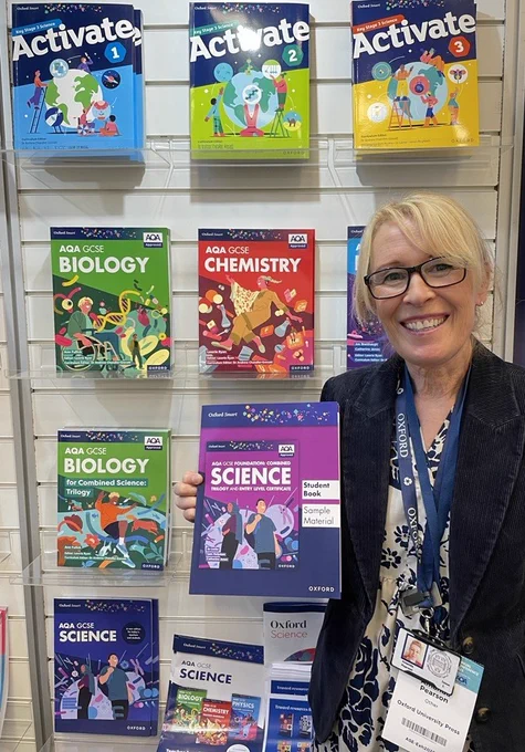 OUP Partnership Manager with new AQA GCSE Science Entry Level Certificate book, with GCSE Biology, Chemisty and Physics plus Oxford Smart Activate Student Books on the stand at the ASE Conference.