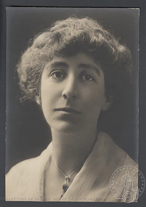 Black and White portrait of a young Jeannette Rankin looking pensively at the camera