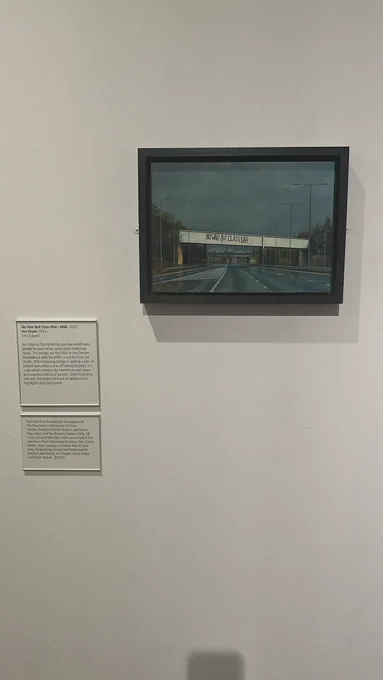 An image showing a pairing by Jen Orpin of a motorway bridge on the M60. The bridge says No War But Class War - the motorway bridge is used as a site of protest.