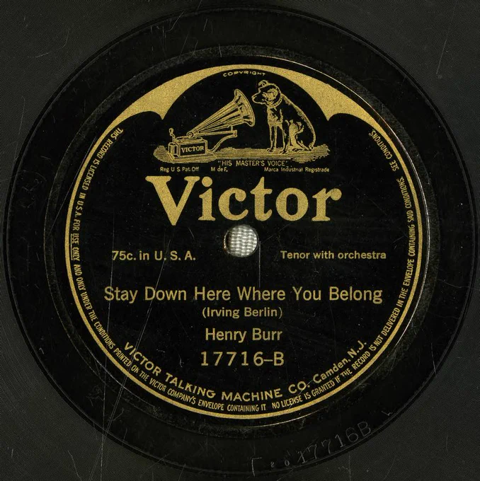 A slightly scratched record label for 'Stay Down Here Where You Belong' sung by Henry Burr.