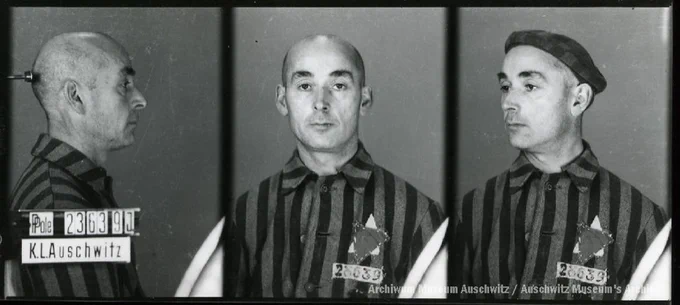 A mugshot registration photograph from Auschwitz. A man with a shaved head wearing a striped uniform photographed in three positions (profile and front with bare head and a photo with a slightly turned head with a hat on). The prisoner number is visible on a marking board on the left.