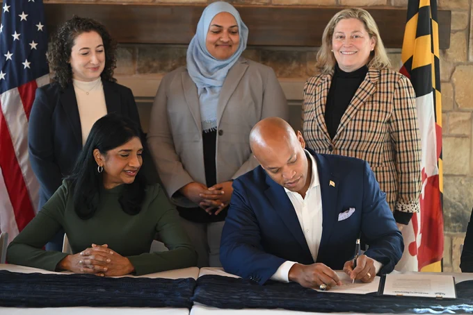 Governor Wes Moore signs executive order alongside Lt. Governor Aruna Miller and members of Moore-Miller Administration