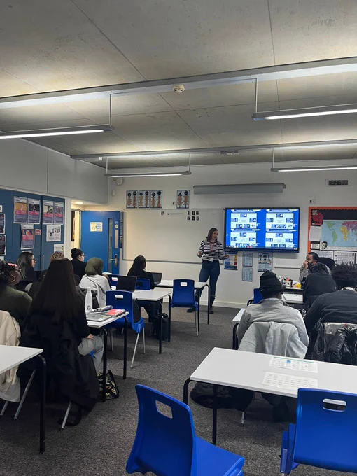 Vicky stood at the front of the classroom speaking to the Hatcham College students.