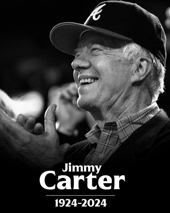 Jimmy Carter, 1924-2024
Pictured: A black and white photo of Jimmy Carter wearing an Atlanta Braves hat.
