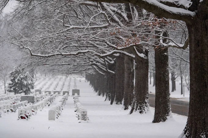 Snow falls in Section 60 of Arlington National Cemetery.